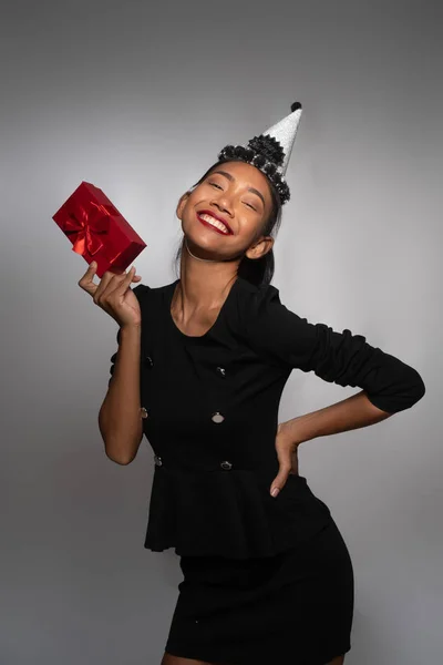 Pretty Happy Asian Girl Birthday Cap Holding Present Isolated Gray — Stock Photo, Image