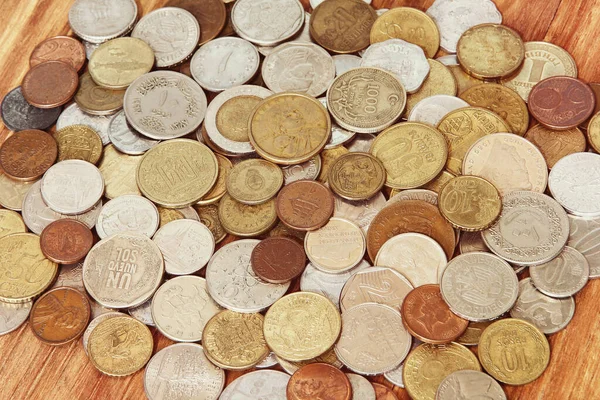 Various coins of world taken closeup as a business background.