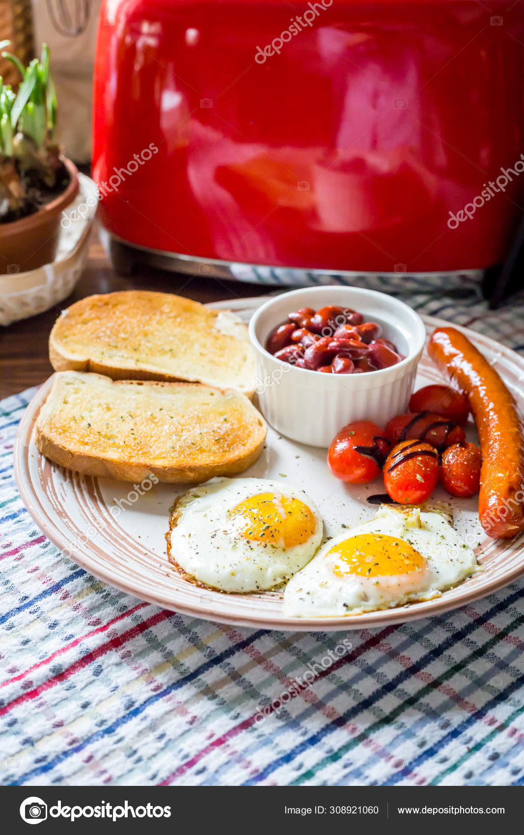Traditional English Breakfast Eggs, Sausage, Tomato, Toasts, B Stock