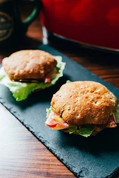 Toasts with Salami or Ham, Cheese, Pickles, Lettuce and Mustard — Stock Photo, Image