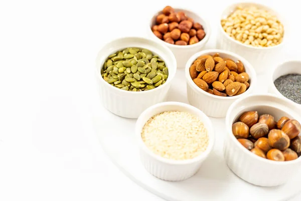 Top View of Variety of Nuts and Seeds on the White Background, F — Stock Photo, Image