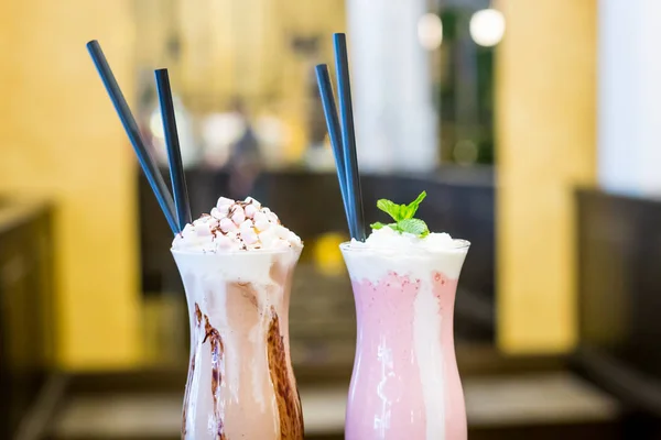 Strawberry and Chocolate Milkshakes with Whipped Cream and Marsh Stock Picture