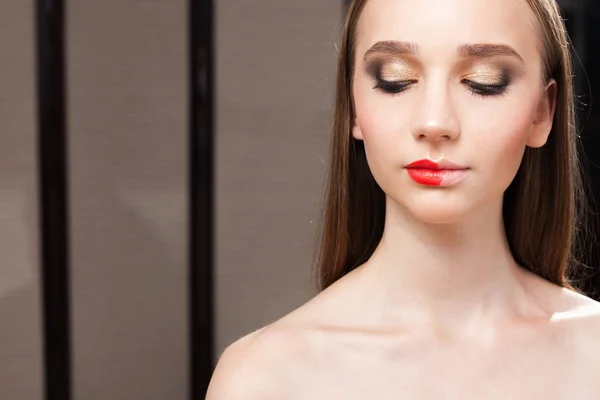 Beautiful girl with halved lipstick on lips close up — Stock Photo, Image