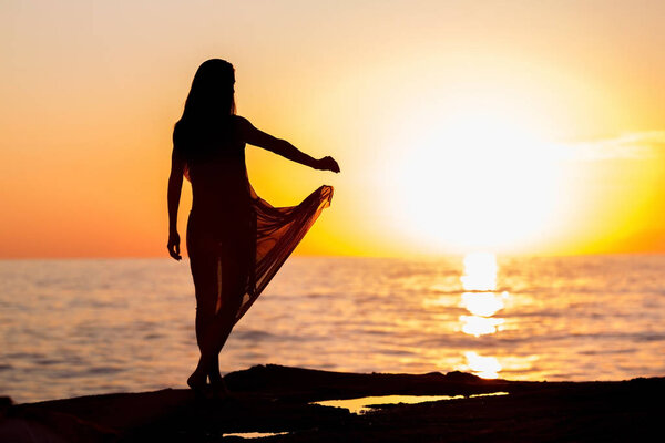 woman dancing at sunset