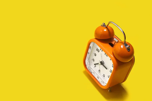Orange alarm clock — стоковое фото