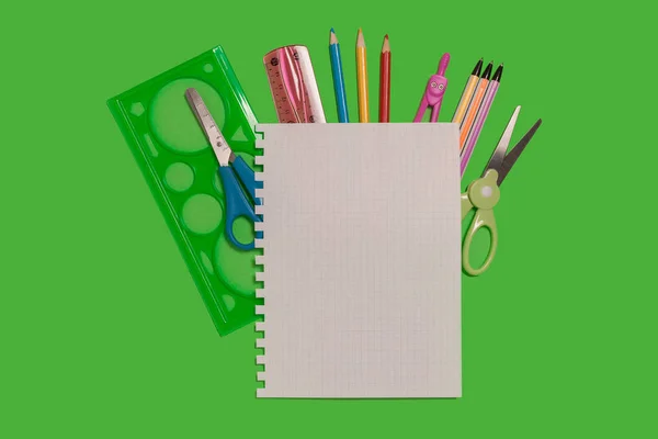 Office supplies on a green background — Stock Photo, Image