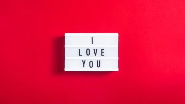 Love You Written Decorative Lamp Bright Red Background Valentine Day — Stock Photo, Image