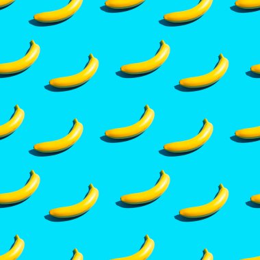 Mavi arka planda parlak sarı muzlar. Kusursuz desen.