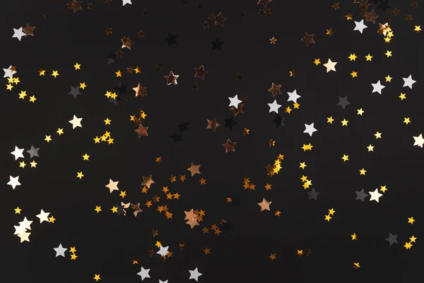 Fundo preto com estrelas brilhantes - conceito de férias — Fotografia de Stock