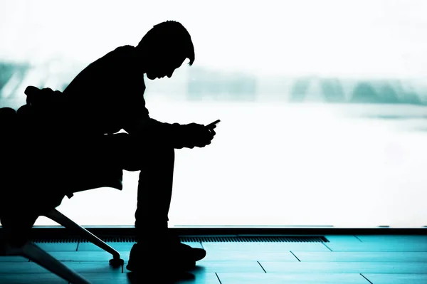 Silhouette Young Man Smartphone Waiting Room Wait Departure Train Plane — Stock Photo, Image
