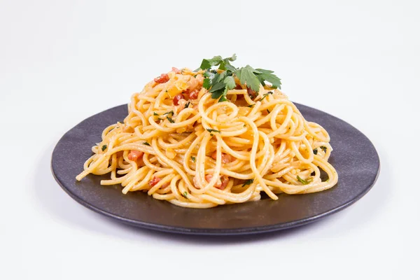 Spaghetti Carbonara Some Parsley Black Plate White Background — kuvapankkivalokuva