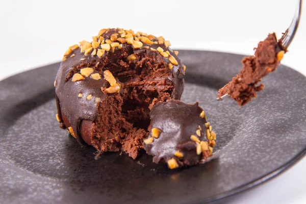 Rum Ball Decorated Chocolate Nuts Black Plate Eaten Fork White — Stock Photo, Image