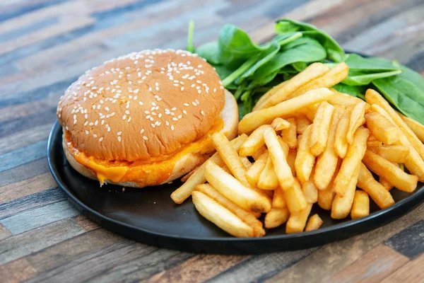 Cheese burger - American cheese burger with Golden French fries