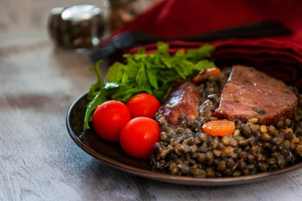 Green lentils with smoked pork sausage smoked choice, carrots and onions