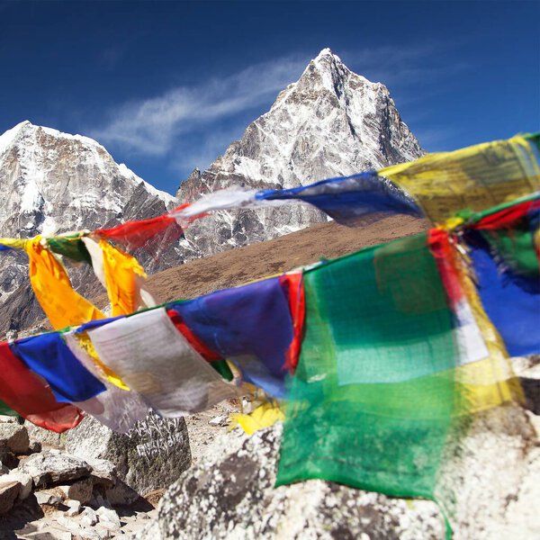 Rows of prayer flags and mount Arakam Tse, Sagarmatha national park, trek to Everest base camp, Khumbu valley, Solukhumbu - Nepal Himalayas mountains