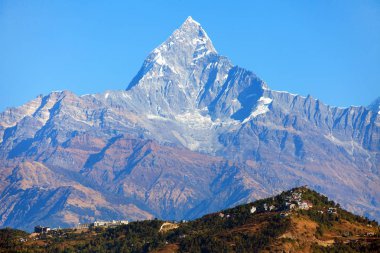 blue colored view of mount Machhapuchhre, Annapurna area, Nepal himalayas mountains clipart