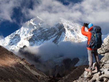 Mount Makalu with clouds and tourist, Nepal Himalayas clipart