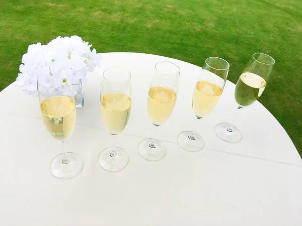 Glasses Champain Arranged Celebration White Table Outdoor Shot Green Loan — Stock Photo, Image