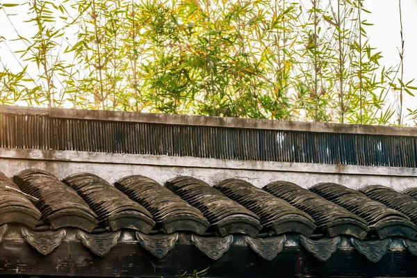 Ancient Chinese roof tiles with bamboo — Stock Photo, Image