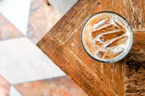 Top view ice latte coffee on wooden table Stock Picture