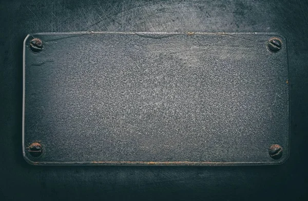 Çelik Arka Plan Üzerinde Perçin Ile Metal Plaka — Stok fotoğraf