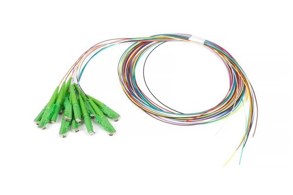 single mode fan out patch cord jumper with green fiber optic connector isolated on white background