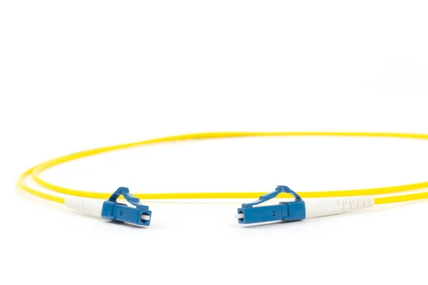 fiber optic single mode small form factor LC patch cord jumper with blue connector isolated on white background