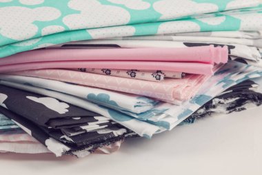Stack of 100% cotton fabric material for tailor or homework, sewing concept clipart