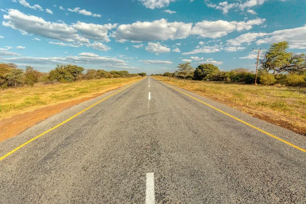 Endless road with blue sky — Stock Photo, Image