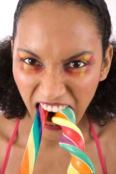 キャンディの杖と怒っている彼女の口で美しい女性 — ストック写真