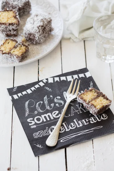 Sponge Cake Pieces Covered Chocolate Coconut Flakes Table Card — Stock Photo, Image