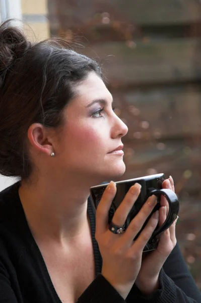 Pretty Brunette Looking Out Window Holding Cup Tea — Stock Photo, Image