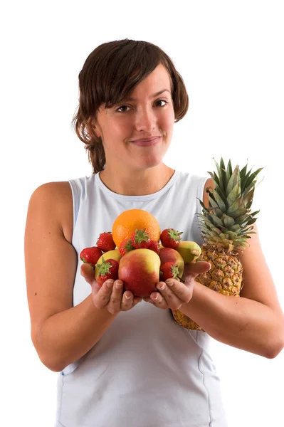 Ganska Brunett Sportiga Kläder Som Bär Hög Med Frukt Händerna — Stockfoto