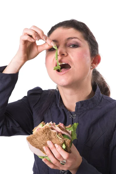 Brünette Frau Isst Sandwich Studio Mit Weißem Hintergrund — Stockfoto