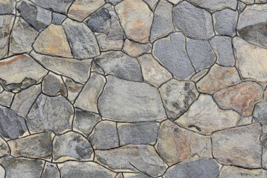 Çatlamış bir taştan bir duvar parçası.