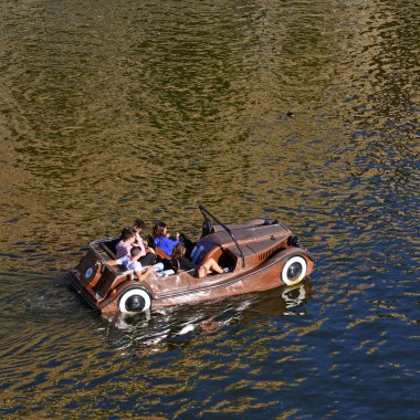 PRAGUE, CZECH REPUBLIC - September 16, 2018: Walking along the Vltava river on a water bike in the form of a car.