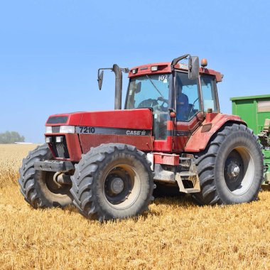 combine harvester working at wheat field, harvesting in the countryside