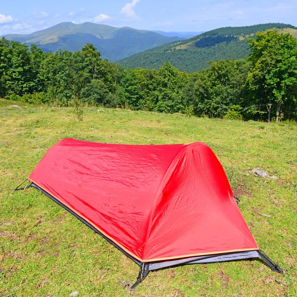 red camping tent in the mountains