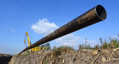 pipelayer machine at work. Pipe in the field