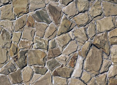 Çatlamış bir taştan bir duvar parçası.
