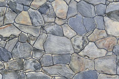 Çatlamış bir taştan bir duvar parçası.