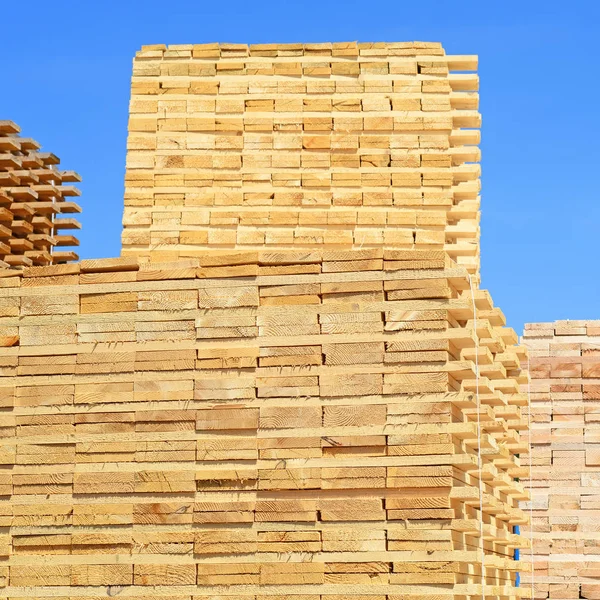 stack of wood planks stacked in the warehouse