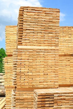 stack of wood planks stacked in the warehouse