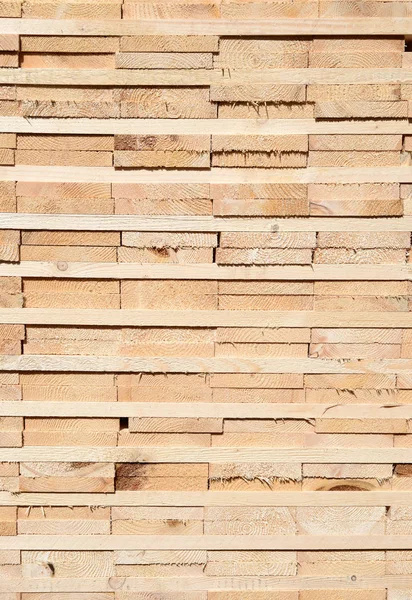 stack of wood planks stacked in the warehouse