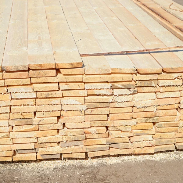 stack of wood planks stacked in the warehouse