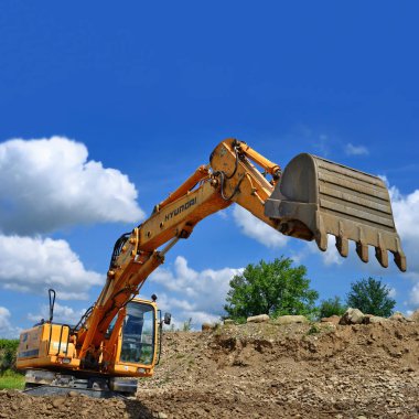 Kalush, Ukraine - July 8: Loading boulders in the car body on the construction of a protective dam near the town of Kalush, Western Ukraine July 8, 2015