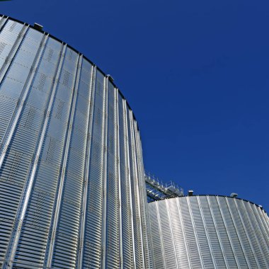 Metal containers for storage of a grain elevator