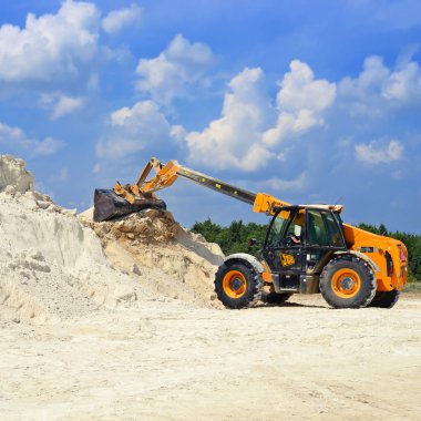 Kalush, Ukraine - July 25: Telescopic handler in the work area near the town Kalush, Western Ukraine July 25, 2016