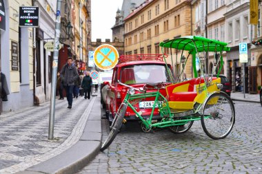 PRAGUE, CZECH REPUBLIC - November 29, 2016: Bicycle rickshaws on an old city street.