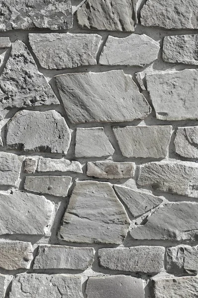 Wall cladding with a crushed stone. Texture.